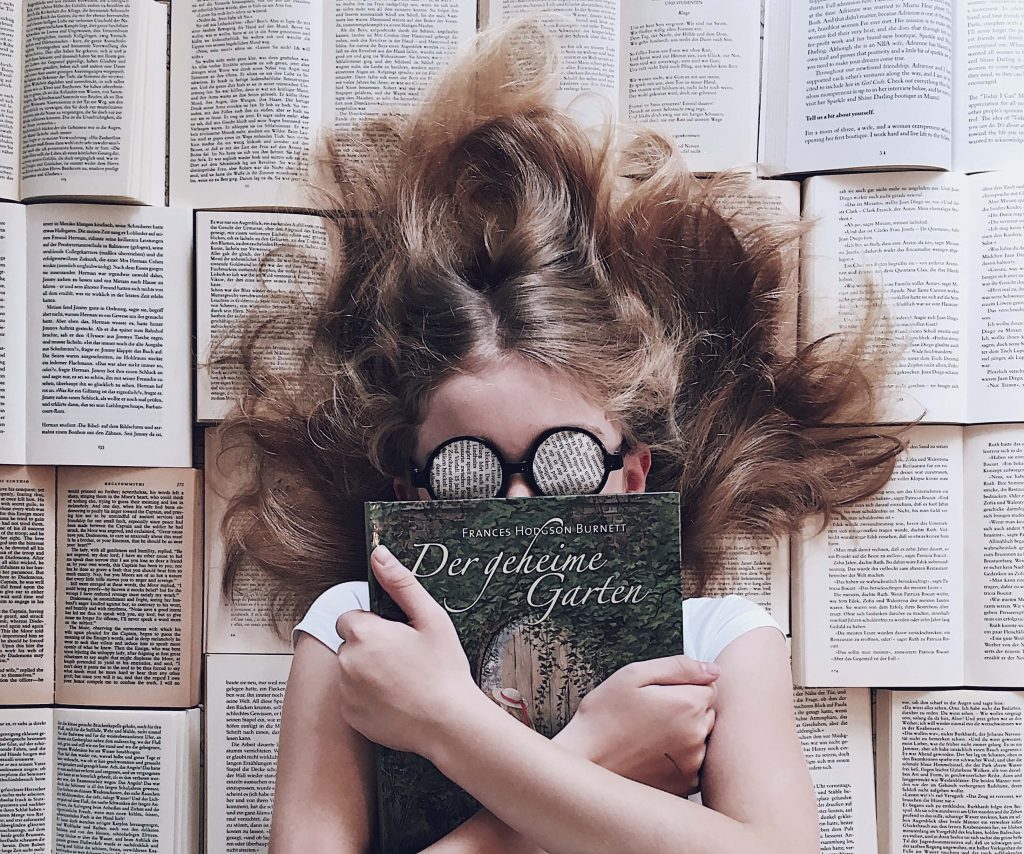 lying on a book of beds